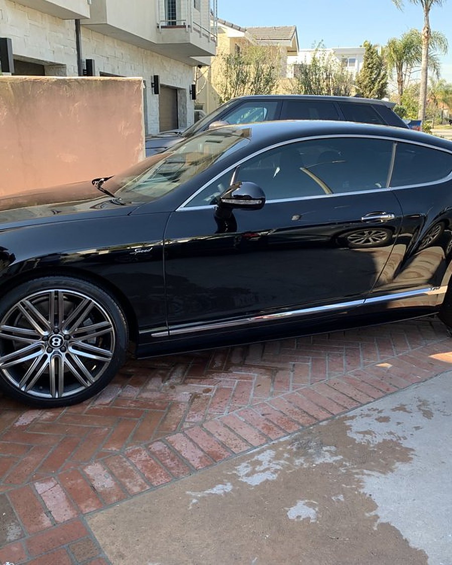 A black Bentley Continental GT after a detail